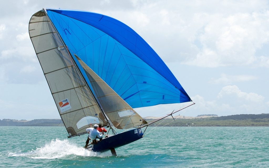 Modern sailing boat under spinnaker at beam reach … rather sportive!